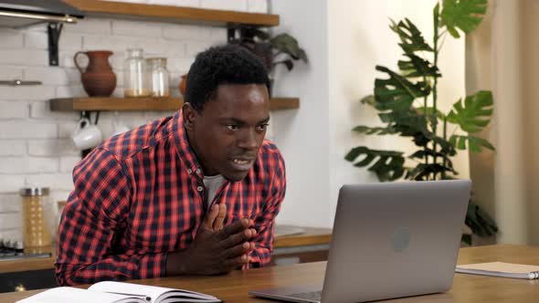 Excited African American Student Looks Laptop Celebrating Admission University