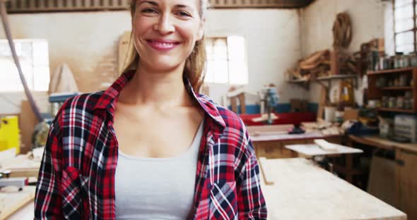 Portrait of attractive carpenter smiling for camera