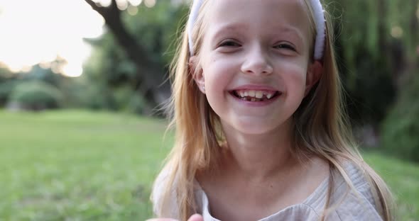 Close Up Emotional Portrait of Caucasian Smiling Teen Girl with Blonde Hair Seven Years Old