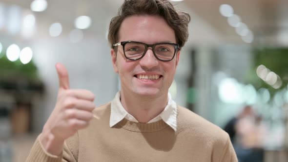 Young Male Designer Showing Thumbs Up Sign