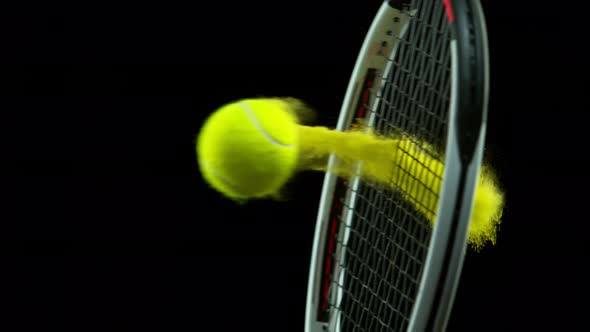 Super Slow Motion Detail Shot of Hitting Tenis Ball Containing Yellow Powder By Racket at 1000 Fps