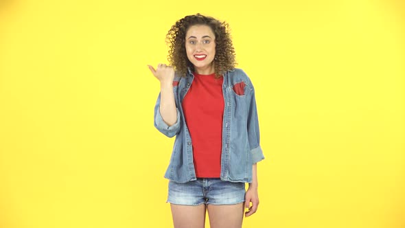 Young Woman Waving Hand and Showing Gesture Come Here on Yellow Background at Studio.