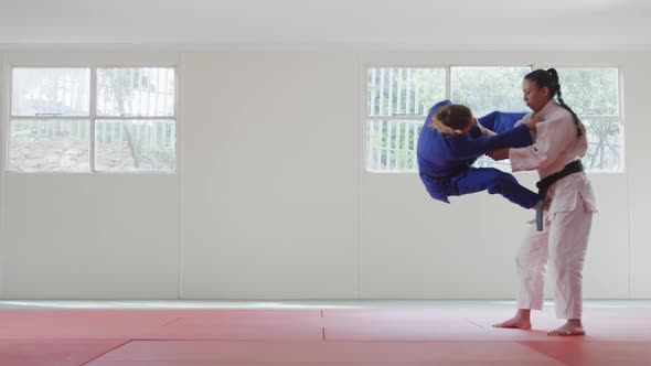 Judokas fighting and immobilizing on the ground