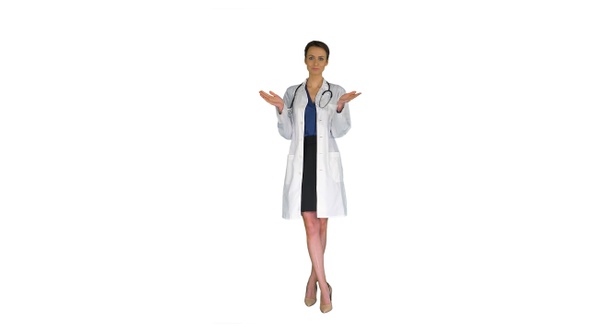 Young woman doctor clapping hands on white background.