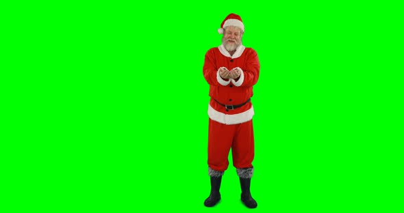 Santa claus standing with hands cupped