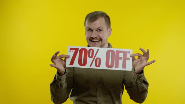 Excited Man Showing Up To 70 Percent Off Inscriptions Signs, Rejoicing Good Discounts, Low Prices