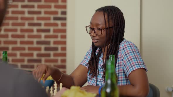 Positive Woman Having Fun with Chess Board Game at Home