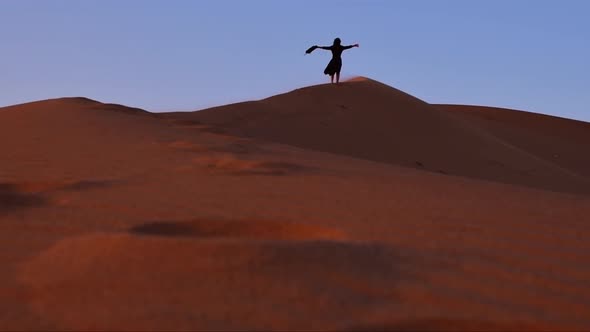Woman Enjoy Freedom On Desert Sand Dune