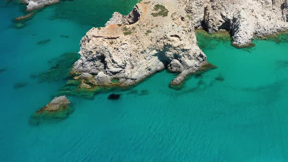 Aerial seascape at the day time. Bay and rocks. Blue water background in the summer.