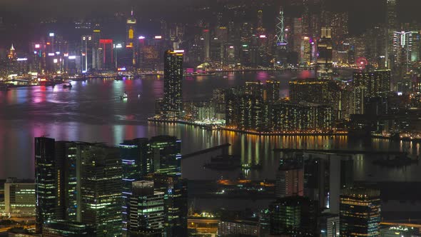 Hong Kong Urban Cityscape Aerial Skyline Panorama Timelapse at Night Pan Up