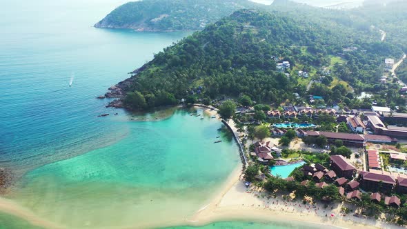 exotic travel adventure. Tropical island with sandbar dividing the turquoise sea between Koh Phangan