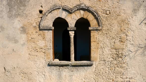 Medieval window, in Gerace