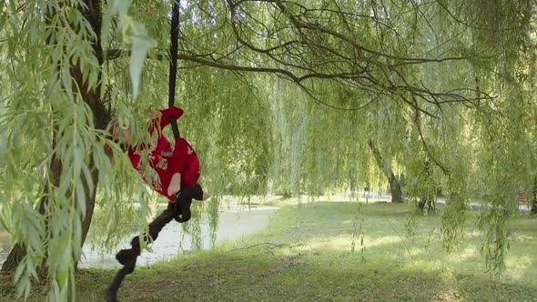 Slow Motion of a Flexible Girl in Aerial Suit