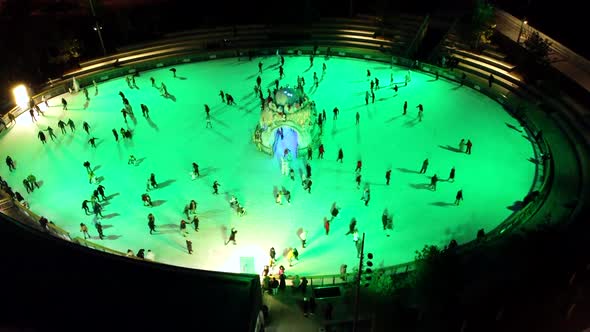 Aerial Drone View Flight Over an Ice Skating Rink Under an Open Sky