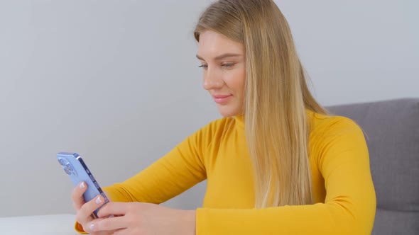 Young adult woman browsing social media app on smart phone in 4k stock video