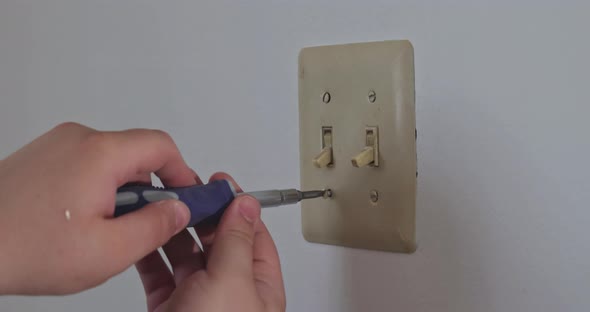 Removing Wall Switch Cover in Order to Mask the Outlet in Preparation for Painting