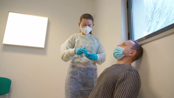 Medical Nurse in Gloves and Mask Test for Suspected Coronavirus Diagnosis