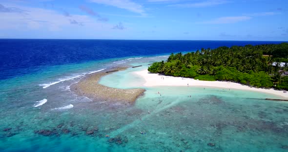 Natural above tourism shot of a white paradise beach and aqua blue water background in high resoluti