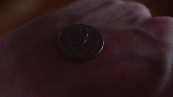 Coin is flipped in the air by hand of man in coin toss 19