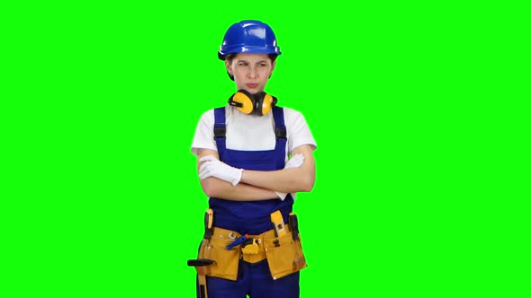 Builder Girl Showing Thumbs Down. Green Screen