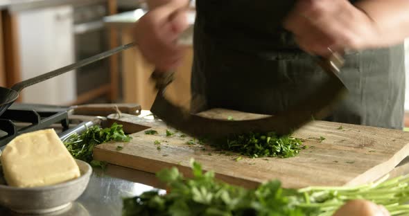 Woman cutting parsley