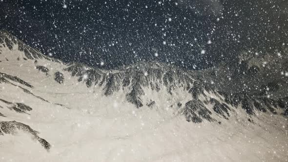 Heavy Snowing Focused on the Snowflakes Mountains in the Background