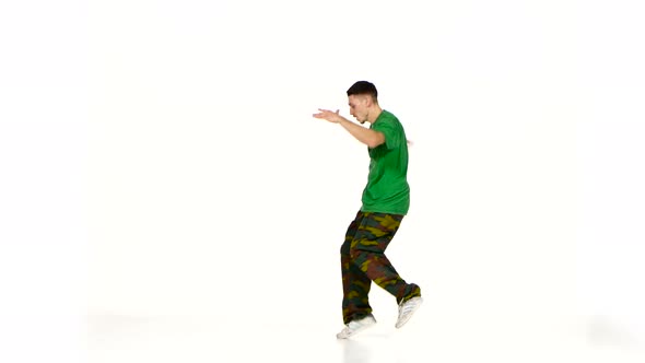 Talanted Young Dancer Man in Green Shirt Dance Breakdance on White