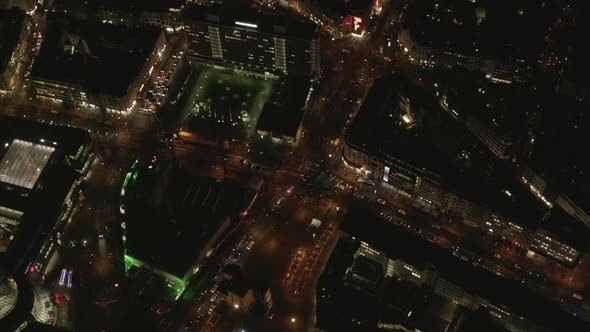 AERIAL: Slow Overhead Shot of City at Night with Lights and Traffic, Cologne, Germany 