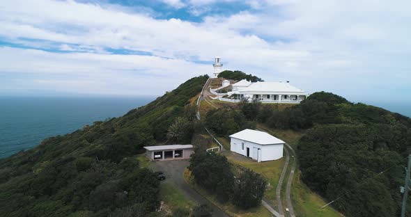 Aerial shot of a lighthouse, slowly pushing in.