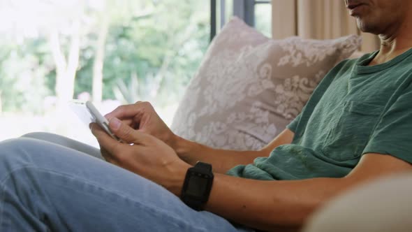 Man using digital tablet in living room 4k