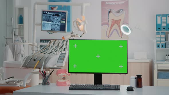 Nobody in Dentist Office with Horizontal Green Screen on Computer