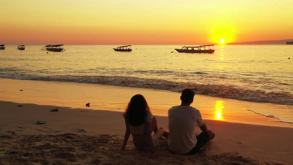 Happy lady and man on honeymoon vacation enjoy life on beach on paradise white sand 4K background