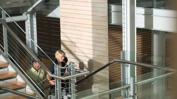 Colleagues walking up stairs