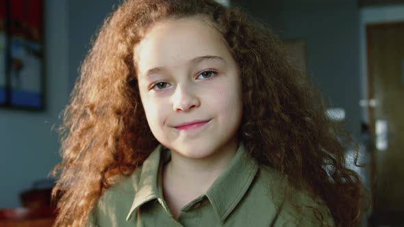 Portrait Funny Little Girl Smiling Child Looking at Camera are Sitting on the Couch at Home Cute Kid