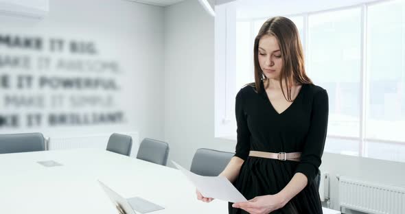 Sitting on Table Concerned Woman Working and Thinking Solving Problem at Office, Serious Attractive