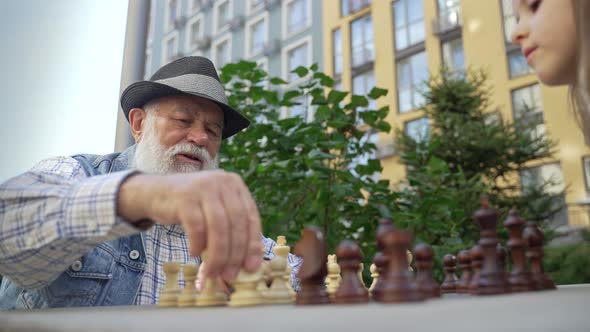 Close Up Concentrated Senior Old Man Playing Chess