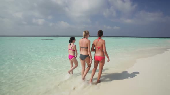 Women Walking on Beach