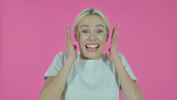 Shocked Young Woman Wondering on Pink Background