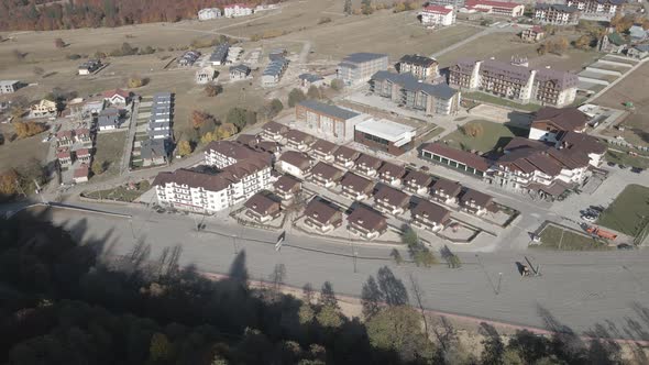 Flying over mountain resort Crystal in Bakuriani, Modern hotel in Georgian mountains