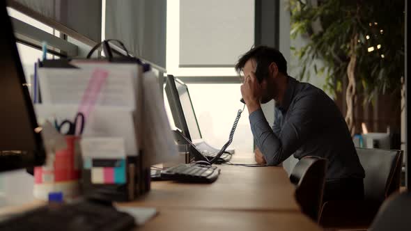 Businessman Working And Talking On Phone. Man Working In Office. Businessman Overworked On Computer