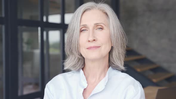 Smiling Mature Greyhaired Woman Laughing in Office Close Up Headshot Portrait