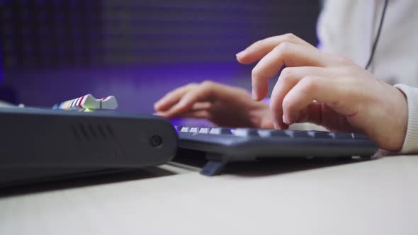 Men's Hands Type on a Computer Keyboard