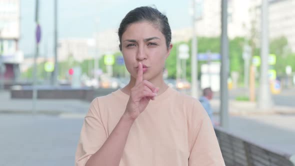 Indian Woman Showing Quiet Sign By Finger on Lips
