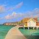 Wooden bridge leading to overwater bungalows on a Maldives Island resort in slow motion - VideoHive Item for Sale
