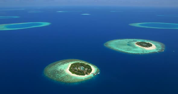Aerial drone view of scenic tropical islands in the Maldives.
