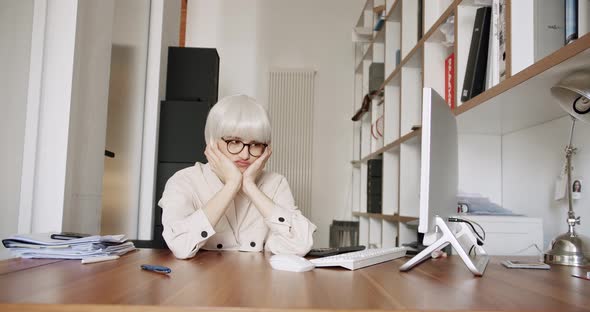 Bored Sad Young Lady Worker Tired Unmotivated and Disinterested in Full Work