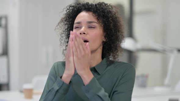 Sick African Woman Sneezing