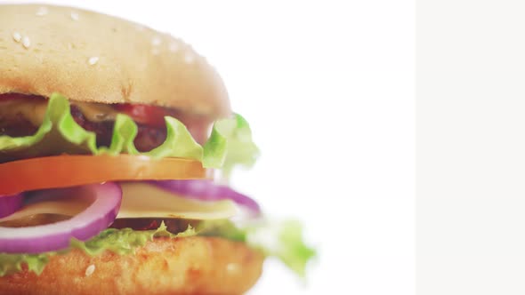 Big and Tasty Burger is Rotating on the Plate