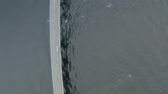 Car Crossing Famous Storseisund Bridge At Atlanterhavsvegen in More and Romsdal, Norway. - Aerial to