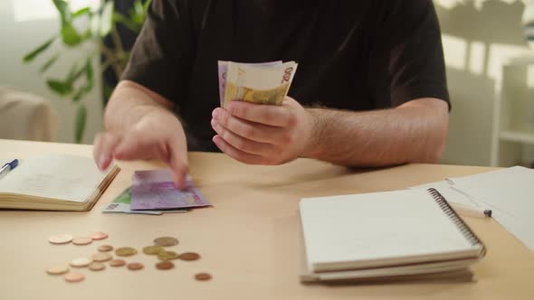 Man Counting Money for Monthly Expenses Rich Person Holding a Stack of Euro in Hands